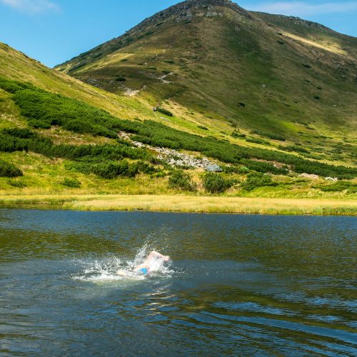 Swimming in the mountain lake Nesamovyte